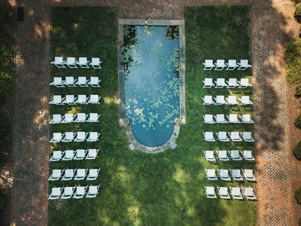 Aerial drone photo of wedding ceremony seating and reflecting pool
